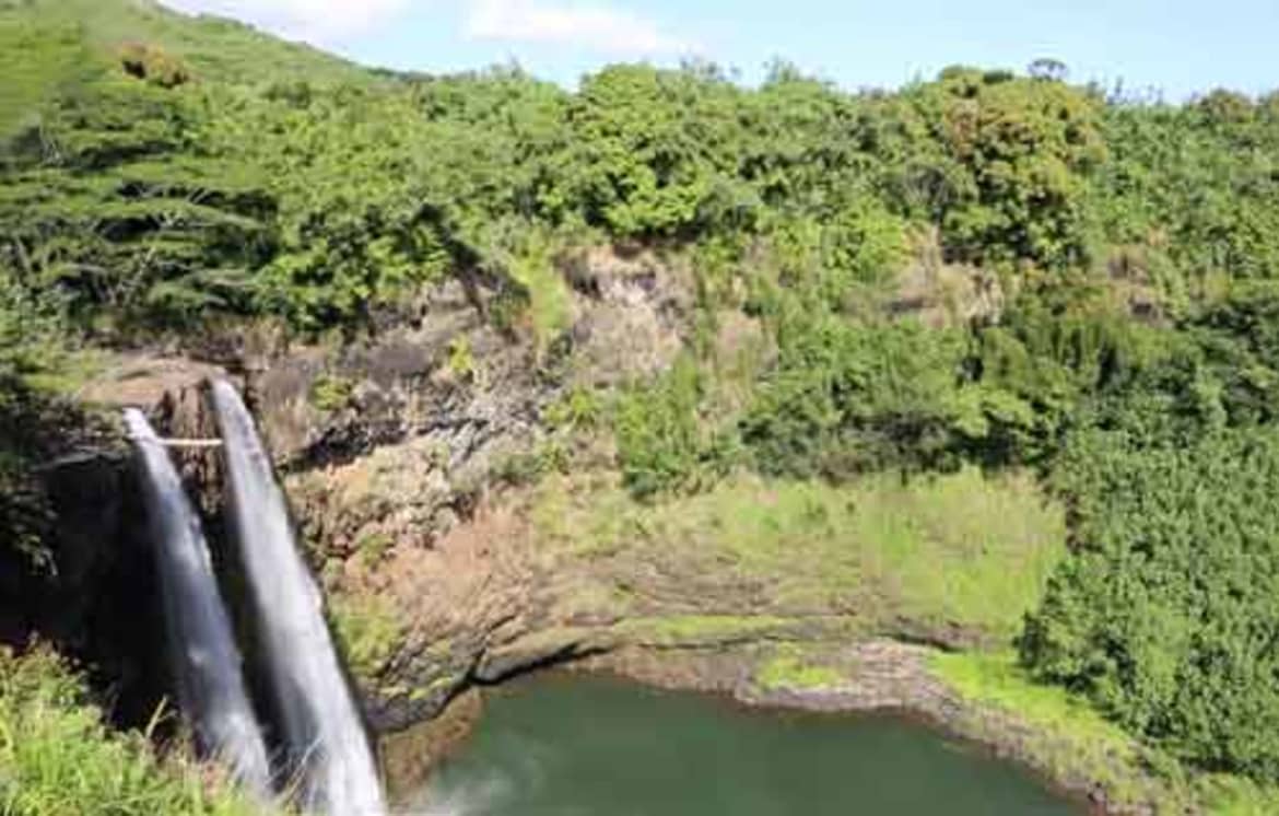 The Waialeale Falls decorate the side of a shield volcano, Mount Wai’ale’ale. Wailua falls in hawaii