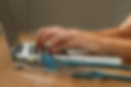 A healthcare professional takes notes during a dual diagnosis treatment session