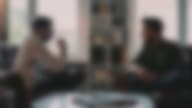 A man talks to his therapist about his rehab process