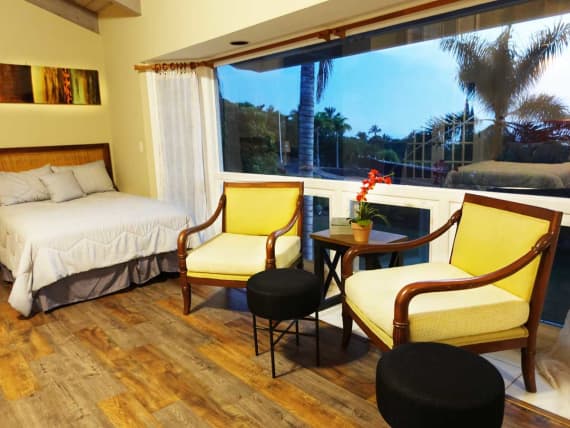 Armchairs in bedroom at Hawaii Island Recovery