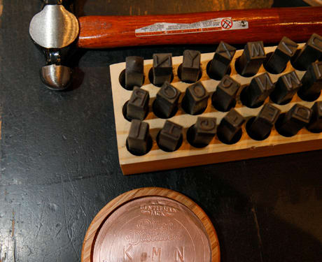 Custom copper coasters were designed on-site featuring event attendees initials or a message of their choice.  