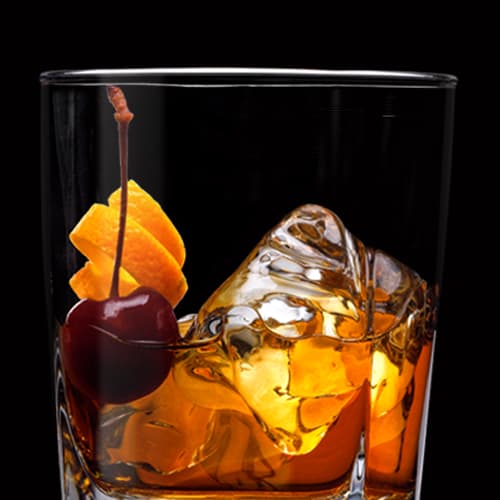 Jack Old Fashioned Cocktail served with orange twist and cherry