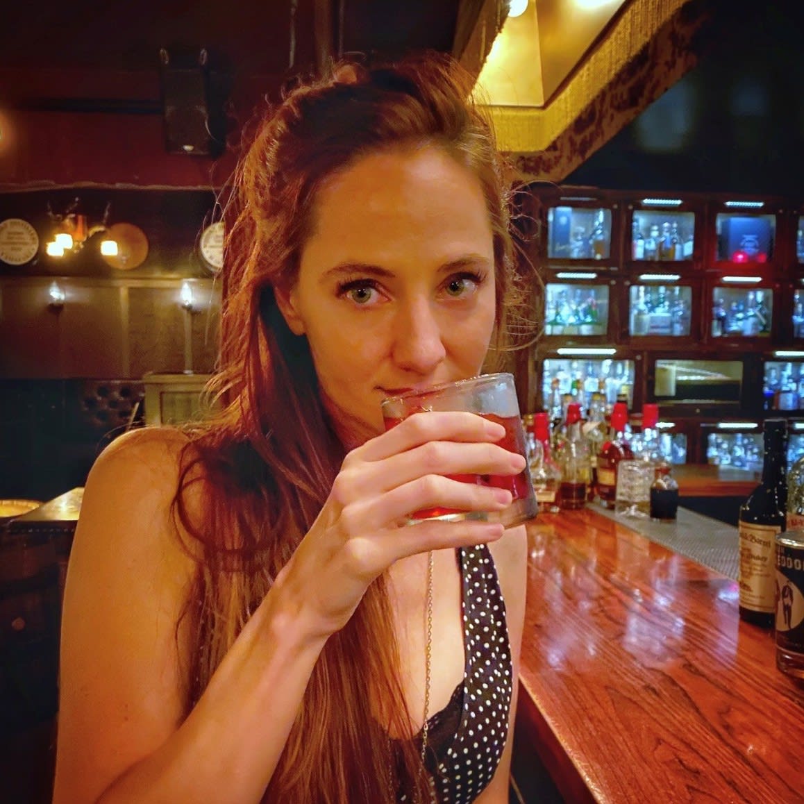 Sarah Jeltema drinking a cocktail