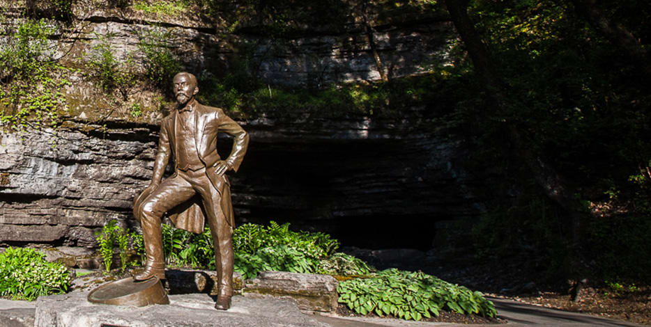 Jack Daniel's statue in front of cave spring