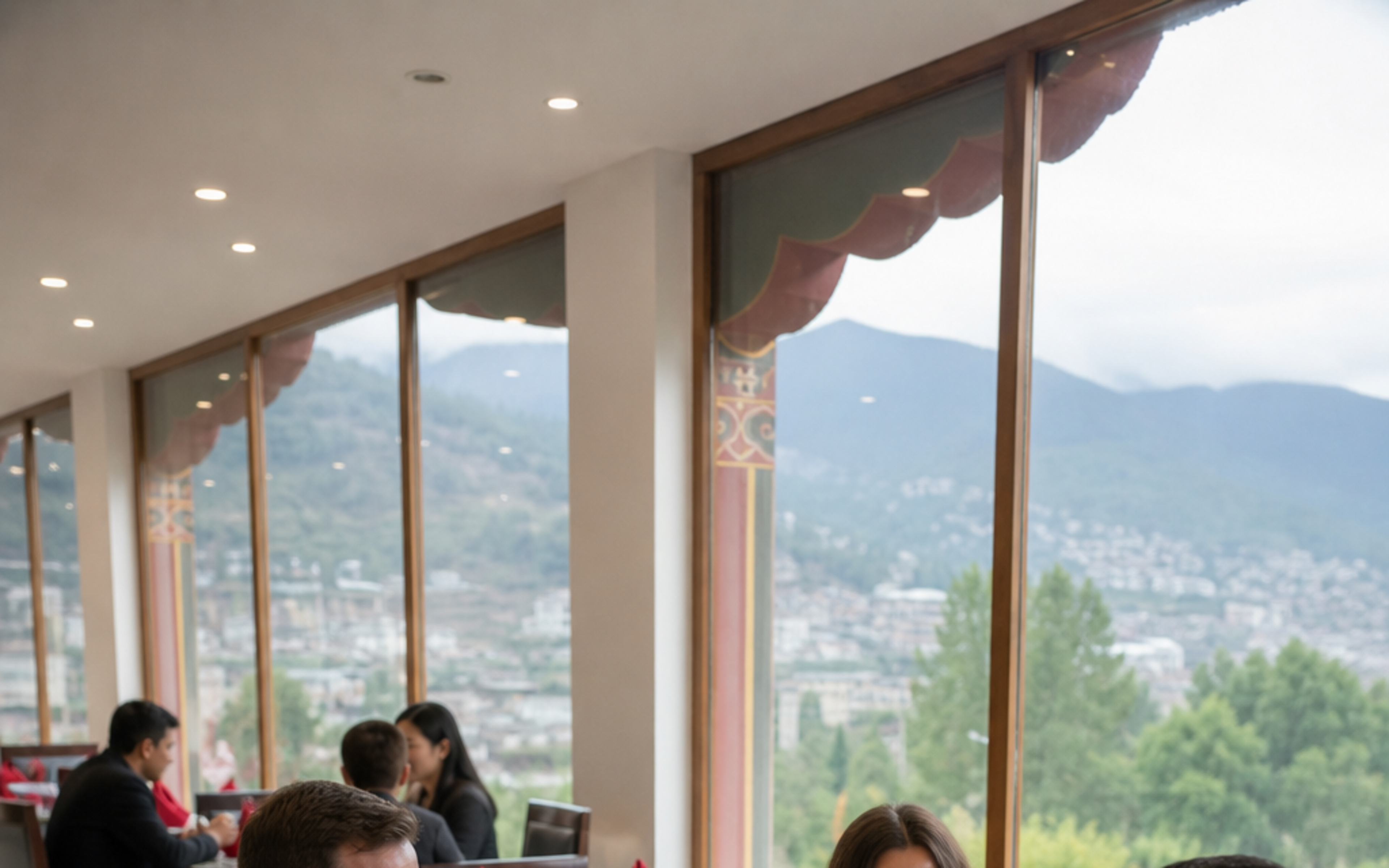 Guests dining at Pelbu Suites restaurant with valley views