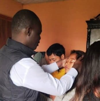 Peter Odhiambo ministering to deaf children