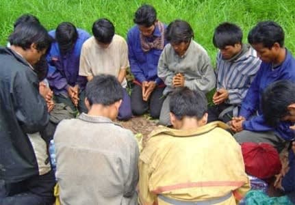 image of Vietnamese Christian men praying, supplied by author