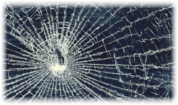 image of shattered glass with bullet hole