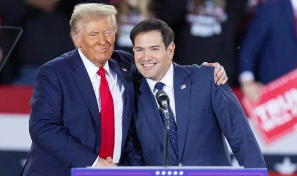 President Donald Trump, left, greets Sen. Marco Rubio of Florida, during a campaign rally in Raleigh, North Carolina, on Nov. 4, 2024. (Photo by Ryan M. Kelly / AFP)