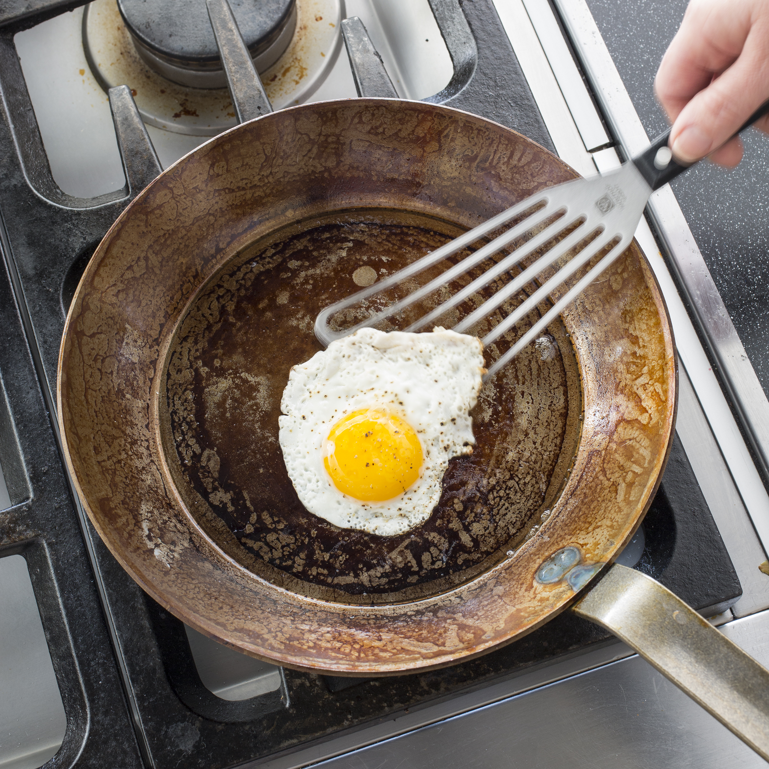 Seasoning Cast Iron and Carbon Steel Pans - The Hotel Leela