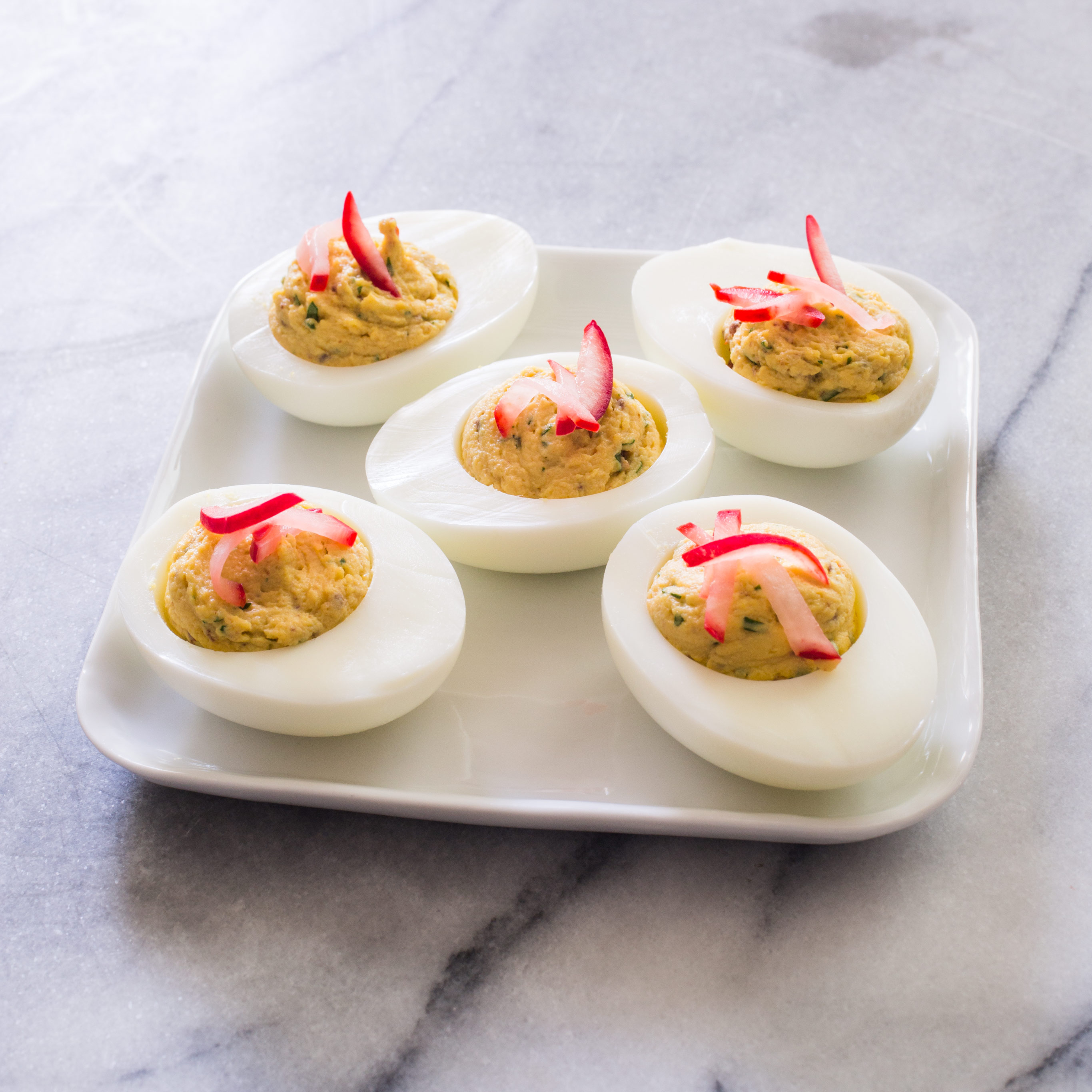 https://res.cloudinary.com/hksqkdlah/image/upload/28215_sfs-chipotle-deviled-eggs-with-pickled-radishes-3.jpg