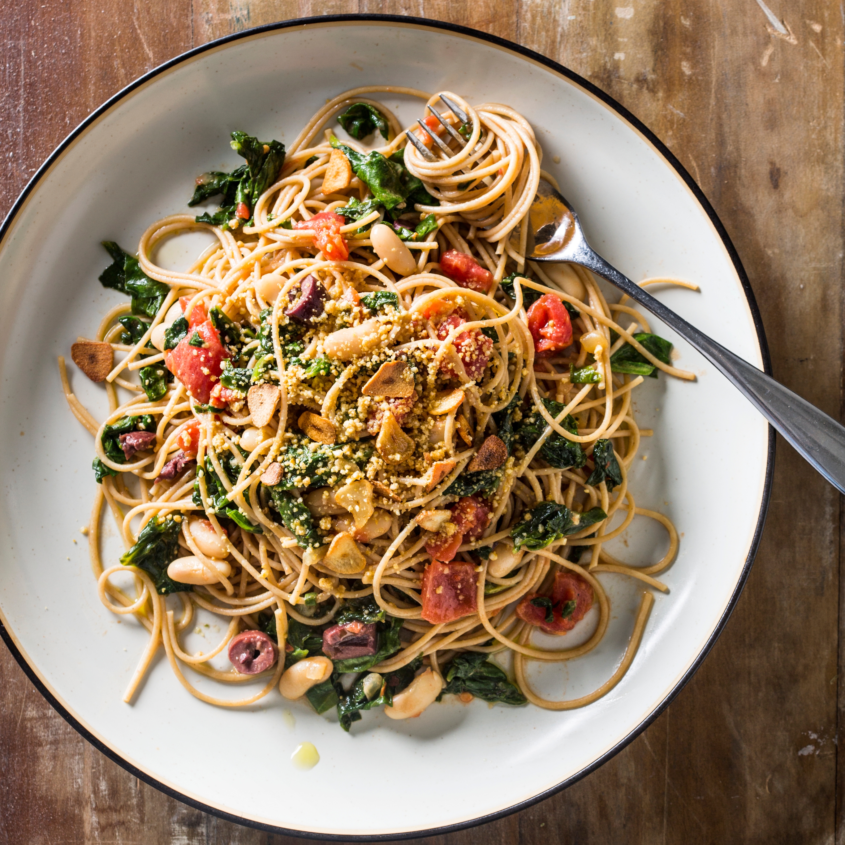 Plant-Based Whole-Wheat Spaghetti with Greens, Beans, and Tomatoes |  America's Test Kitchen Recipe