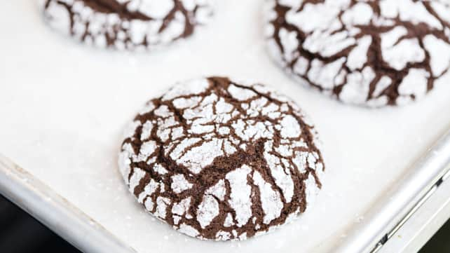 Baked cookies cooling on a rimmed baking sheet.