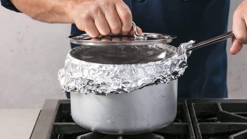 Why Your Pot Lid Is So Vital For Making Perfectly Cooked Rice