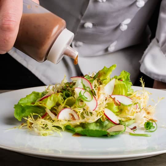 Frisee And Bibb Lettuce Salad With Radishes Scallions And Fried