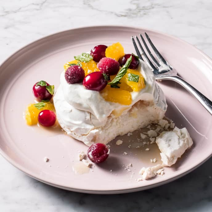 Individual Orange, Cranberry, and Mint Pavlovas with Whipped Cream