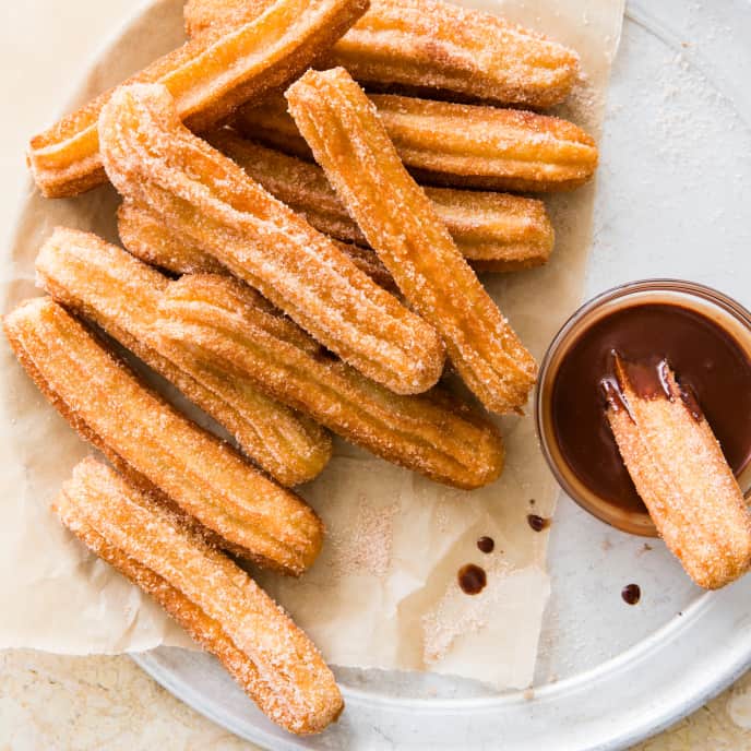 Mexican-American churro topped with vanilla soft serve and chocolate syrup