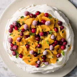 Orange, Cranberry, and Mint Pavlova with Whipped Cream