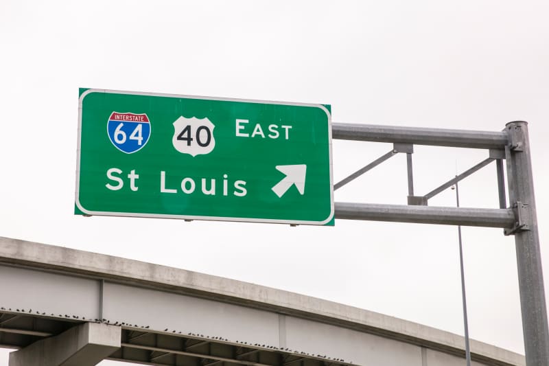 A sign for I-64/U.S. Route 40 East toward St. Louis is visible along a highway near St. Louis, MO.