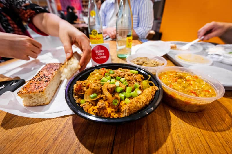 A table covered in a lunch order from Kayma