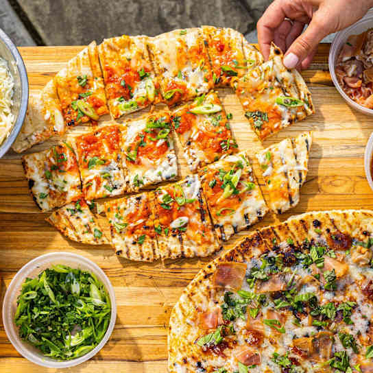 Thin-Crust Grilled Pizza with Fontina, Pecorino, and Scallions