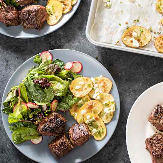 Skillet Steak Tips with Cheesy Roasted Potatoes and Mesclun Salad