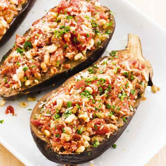 Slow-Cooker Stuffed Spiced Eggplants With Tomatoes and Pine Nuts