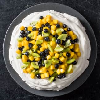 Mango, Kiwi, and Blueberry Pavlova with Whipped Cream