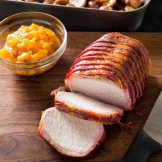 One-Pan Bacon-Wrapped Pork Loin with Roasted Red Potatoes and Peach Sauce