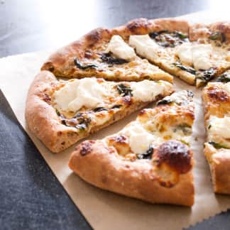 Thin-Crust Whole-Wheat Pizza with Garlic Oil, Three Cheeses, and Basil