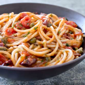 Bowl of spaghetti with tomatoes