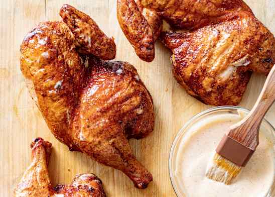 Alabama BBQ Chicken on a Charcoal Grill