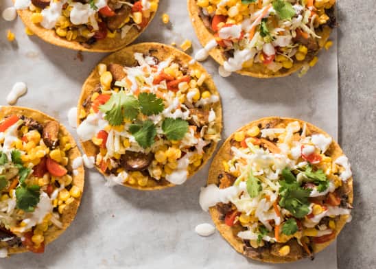 Sheet-Pan Chorizo, Corn, and Tomato Tostadas with Lime Crema