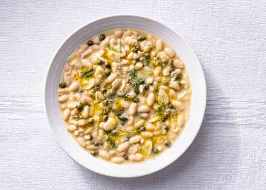 Piccata beans in a white bowl