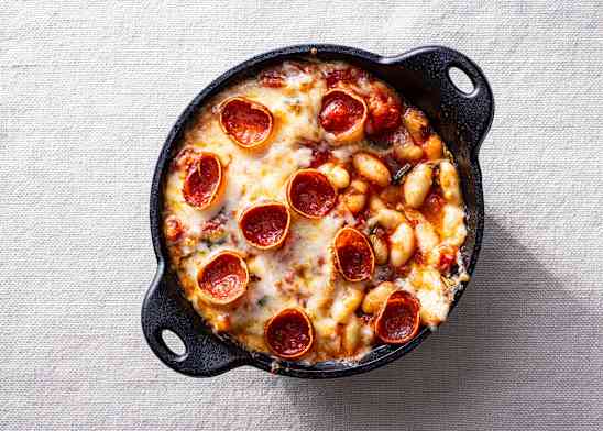 Pepperoni pizza beans in a cast-iron skillet