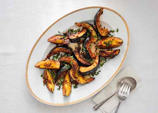 Roasted Acorn Squash with Pine Nuts, Honey, and Parsley