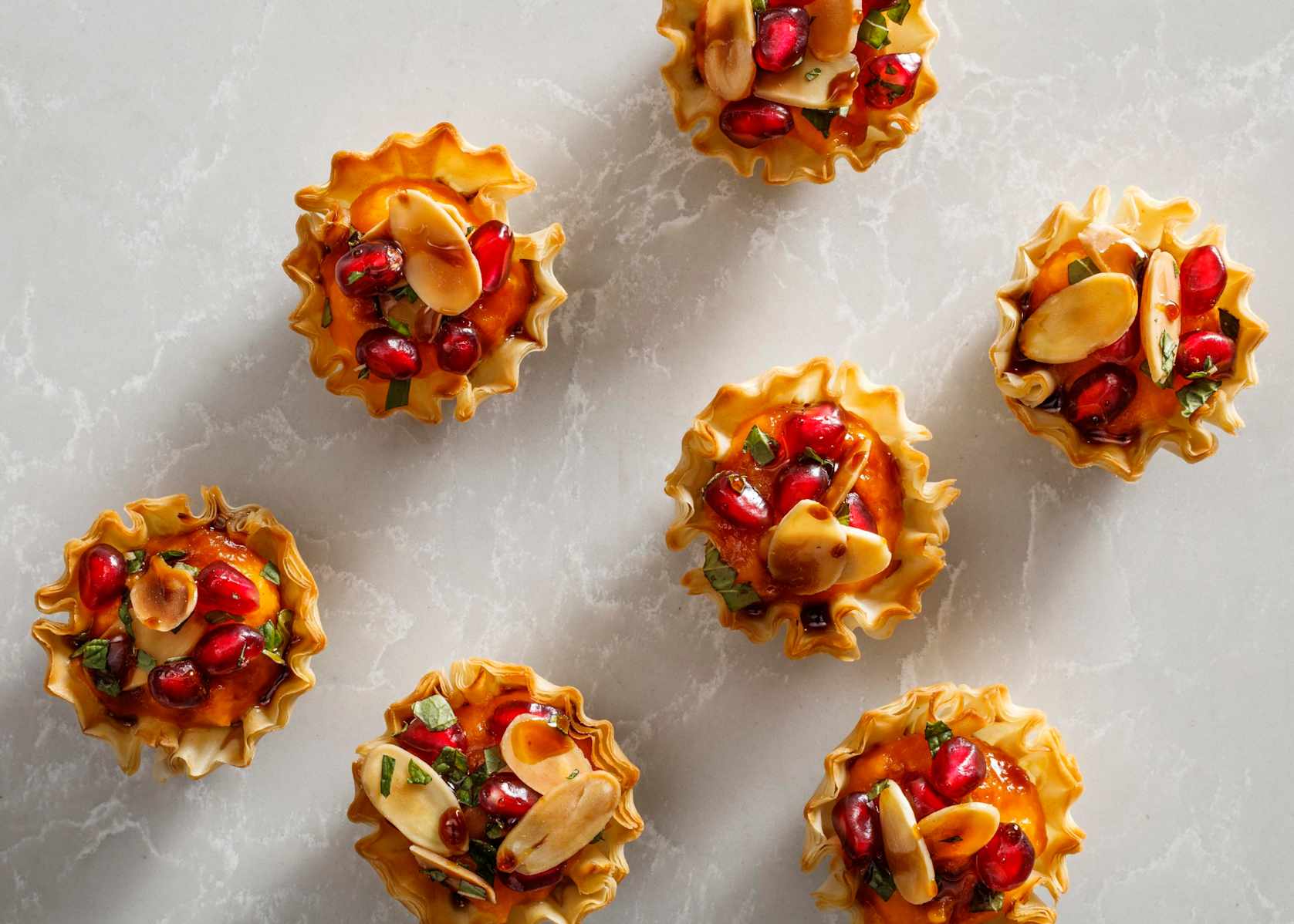 Butternut Squash Tartlets with Almonds, Pomegranate, and Mint