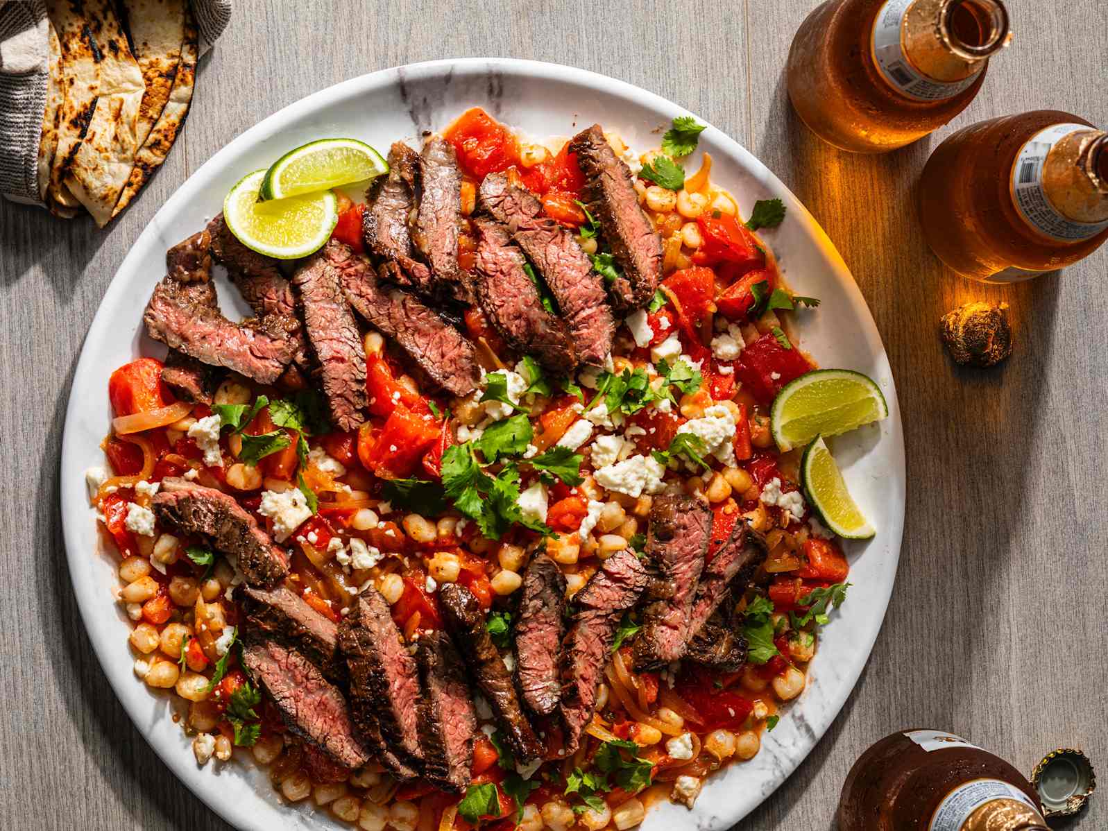 Seared Skirt Steak with Hominy and Tomatoes