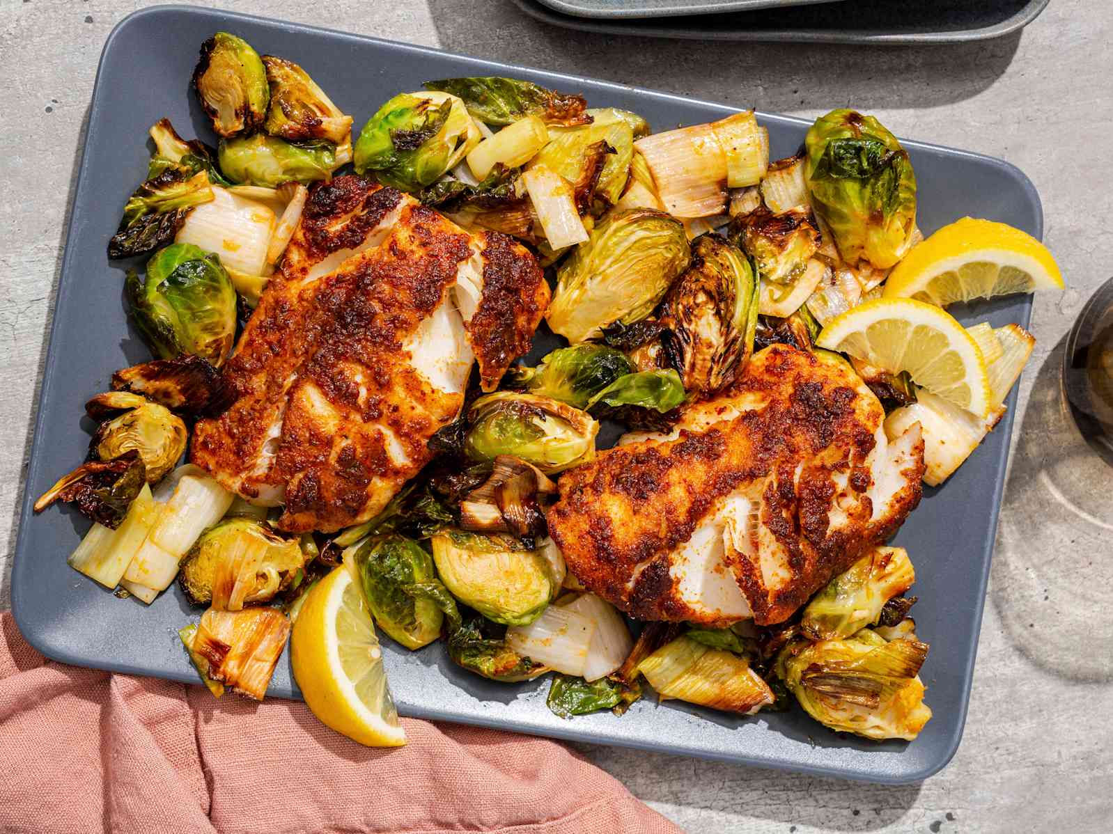 Air-Fryer Harissa-Rubbed Haddock with Brussels Sprouts and Leek on a slate blue serving dish