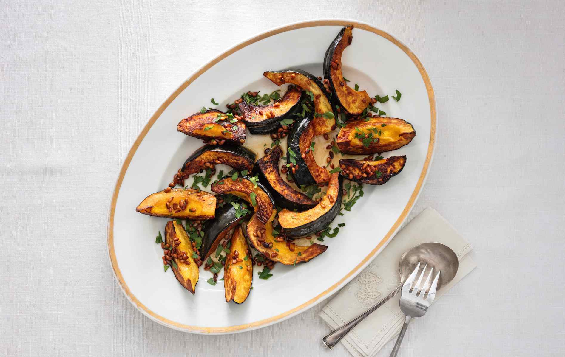 Roasted Acorn Squash with Pine Nuts, Honey, and Parsley
