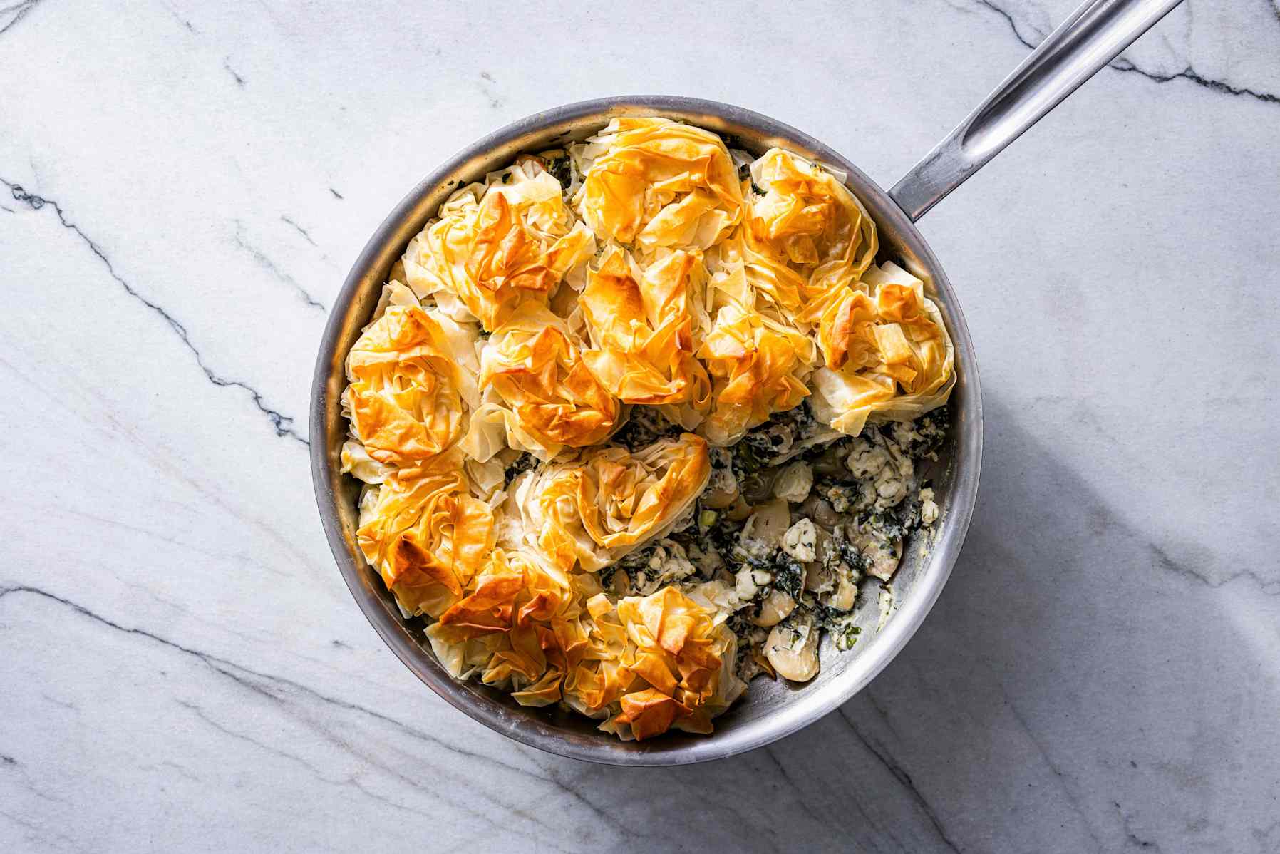 Spanakopita beans in a skillet on the counter