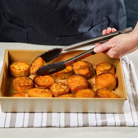 Gently loosen potatoes from pan with metal spatula, then flip them with tongs.