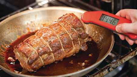 using an instant-read thermometer to temp roast pork