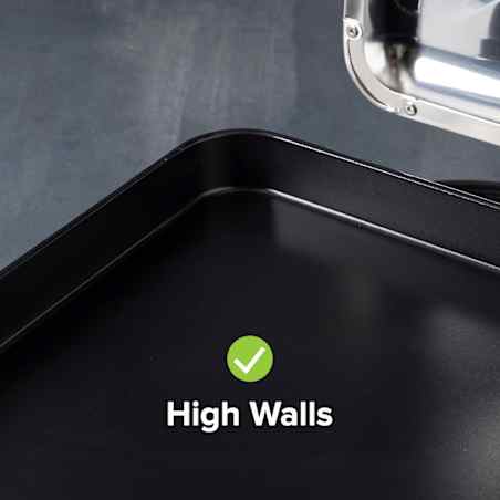Close up of the high walls of an electric griddle