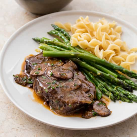 One-Pot Braised Blade Steaks with Mushrooms, Vidalias, and Steamed Asparagus