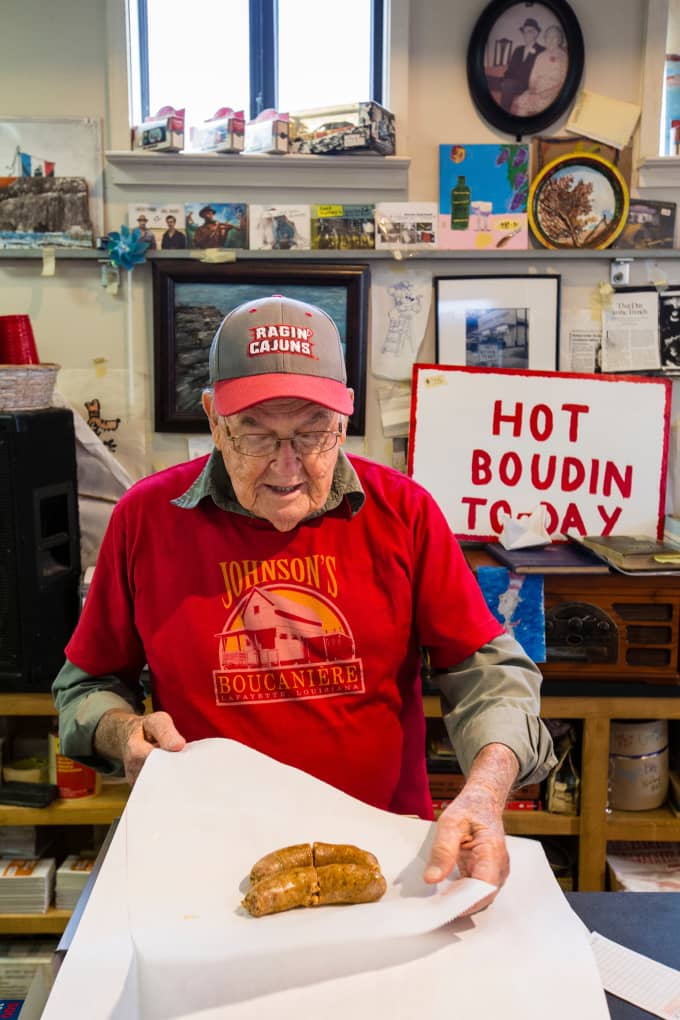 Wallace Johnson wrapping links of boudin at Johnson’s Boucanière in Lafayette, Louisiana