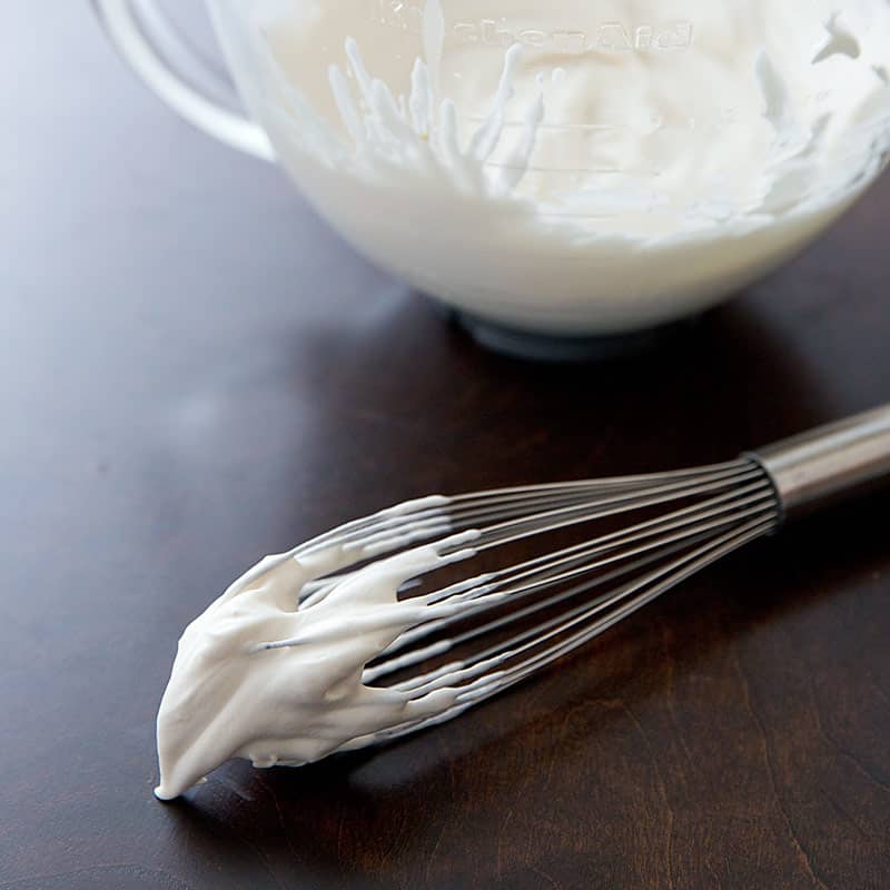 Bowl and whisk of whipped cream