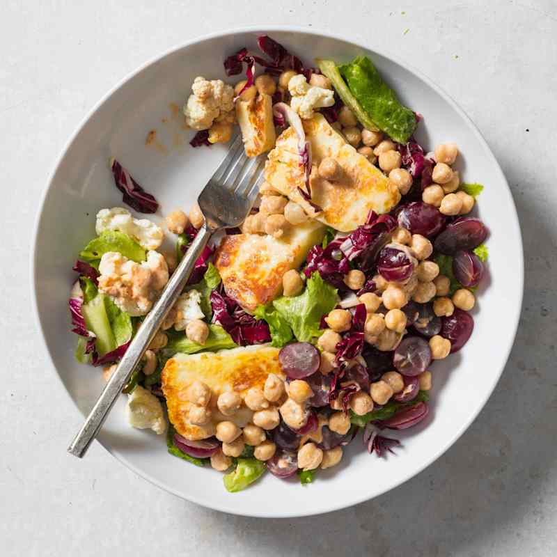 Hearty Green Salad with Chickpeas, Pickled Cauliflower, and Seared Halloumi
