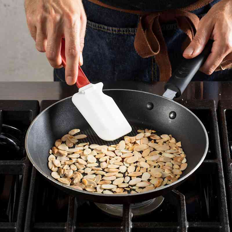 STP_RoastedCauliflowerSaladWithGoldenRaisinAndAlmonds_ToastingSmallAmountOfNuts_38117.jpg