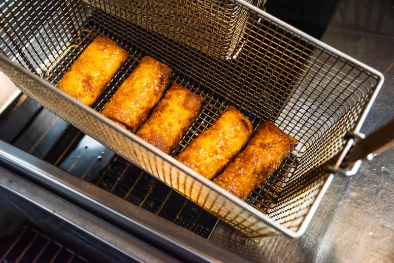 Egg rolls in the deep fryer